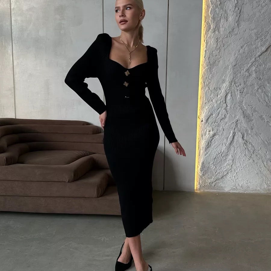 Woman in a black long-sleeved dress showcasing modern fashion in ملابس selections