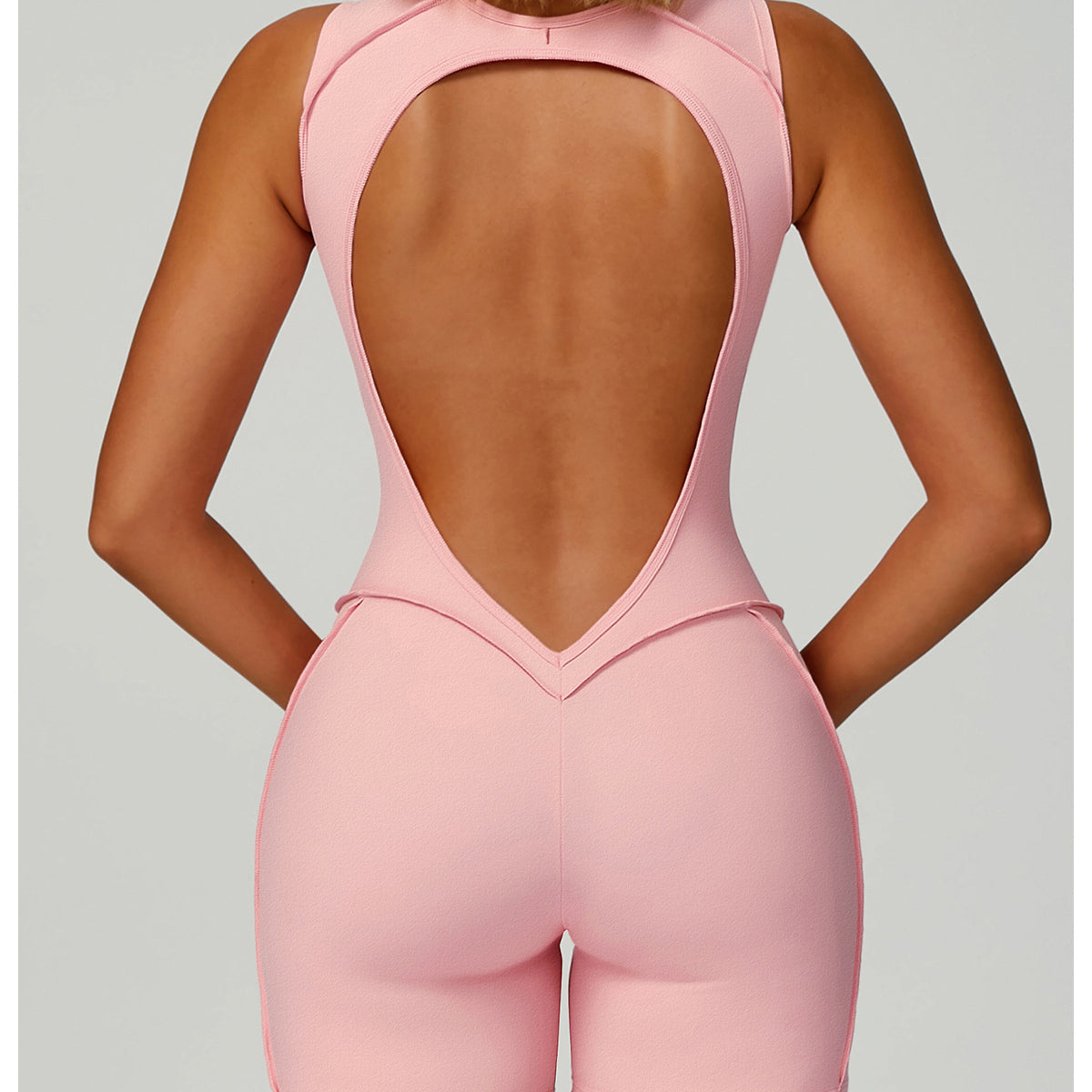 Pink Langry fashion yoga jumpsuit with open back and high-waisted shorts