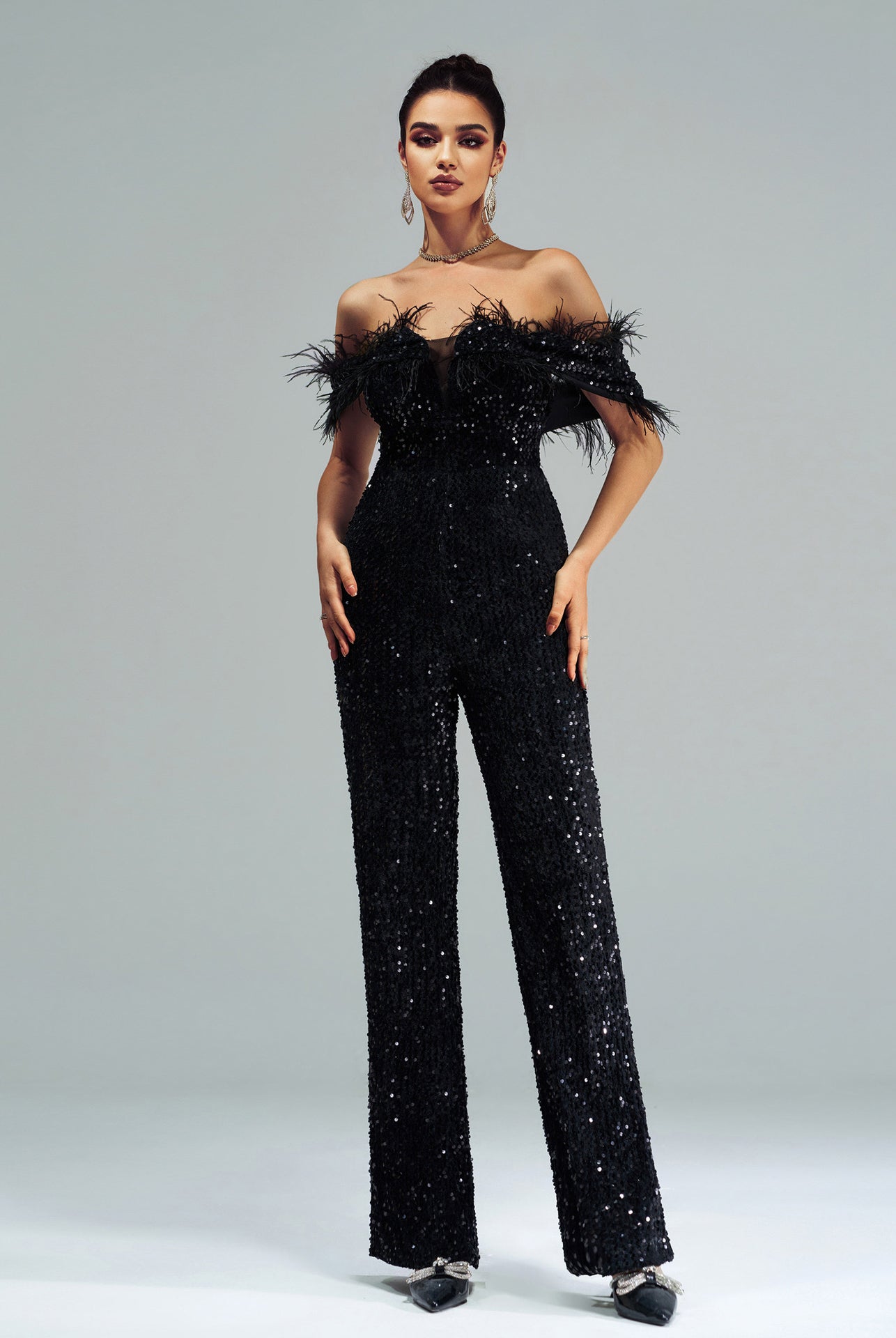 Elegant black sequined jumpsuit with feather trim from High End Cocktail Jumpsuit collection