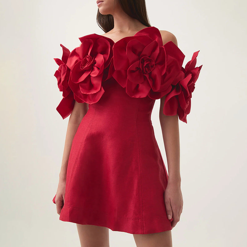 Red cocktail dress featuring floral embellishments, perfect for elegant fashion occasions