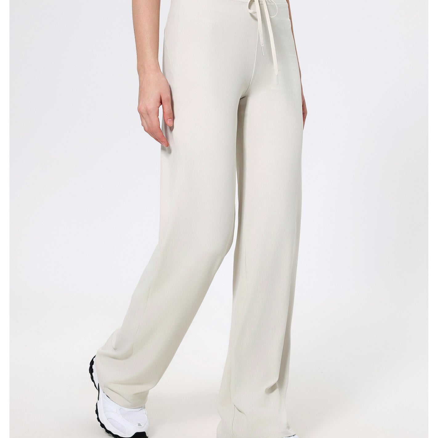 Cream-colored knit sweatpants with drawstring waist for stylish and comfortable fashion wear