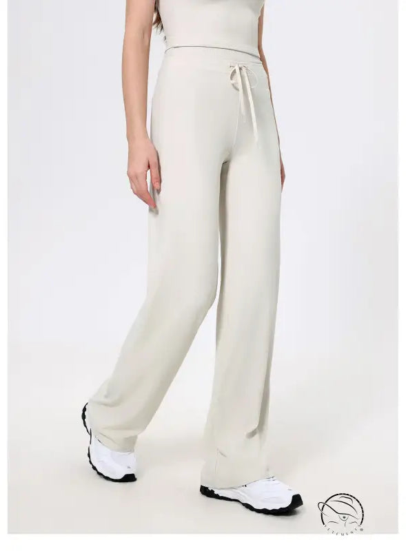 Langry cream knit sweatpants with drawstring, black white sneakers