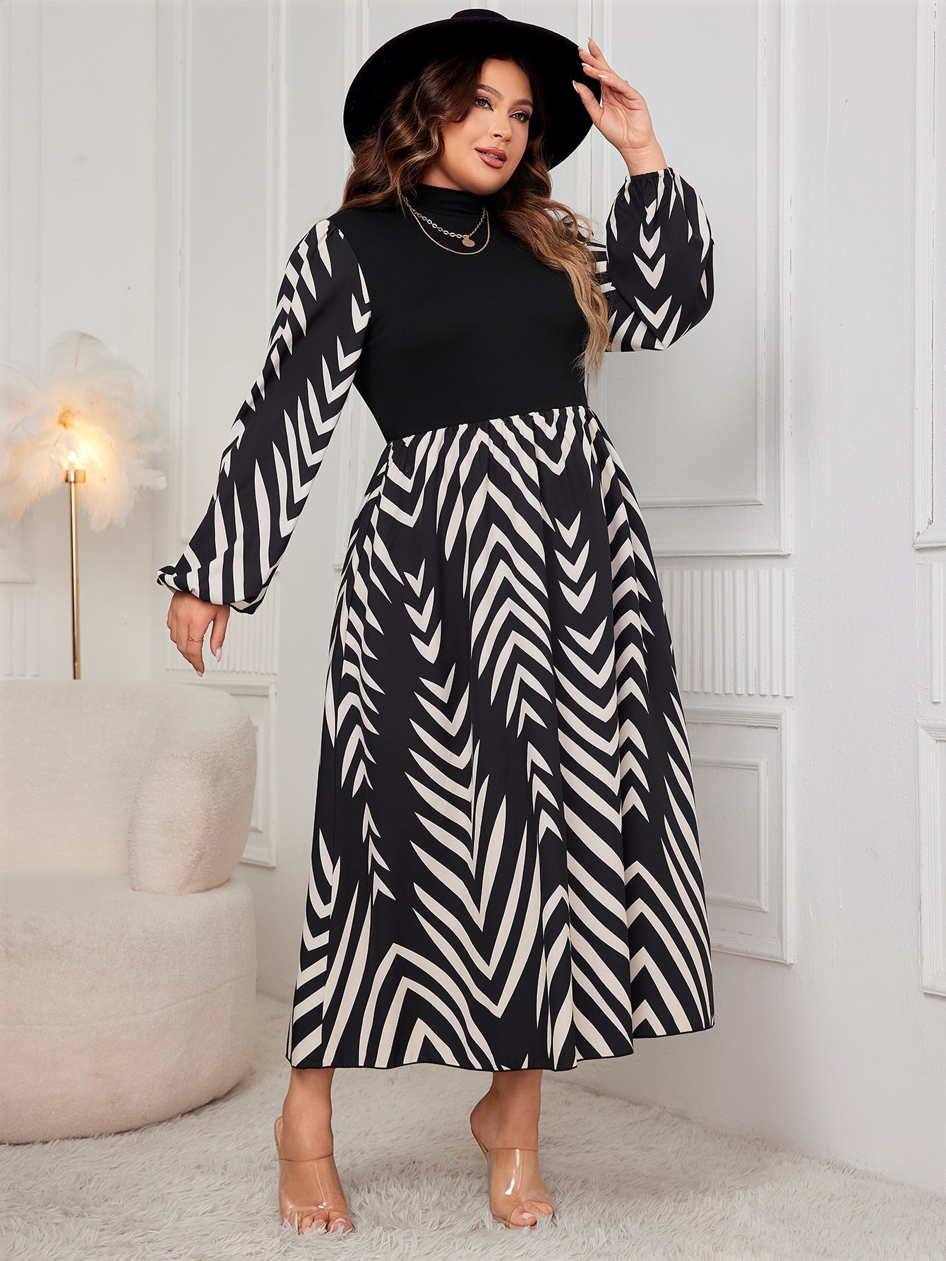 Elegant Puff Sleeve High Waist Dress features a stylish black and white patterned design