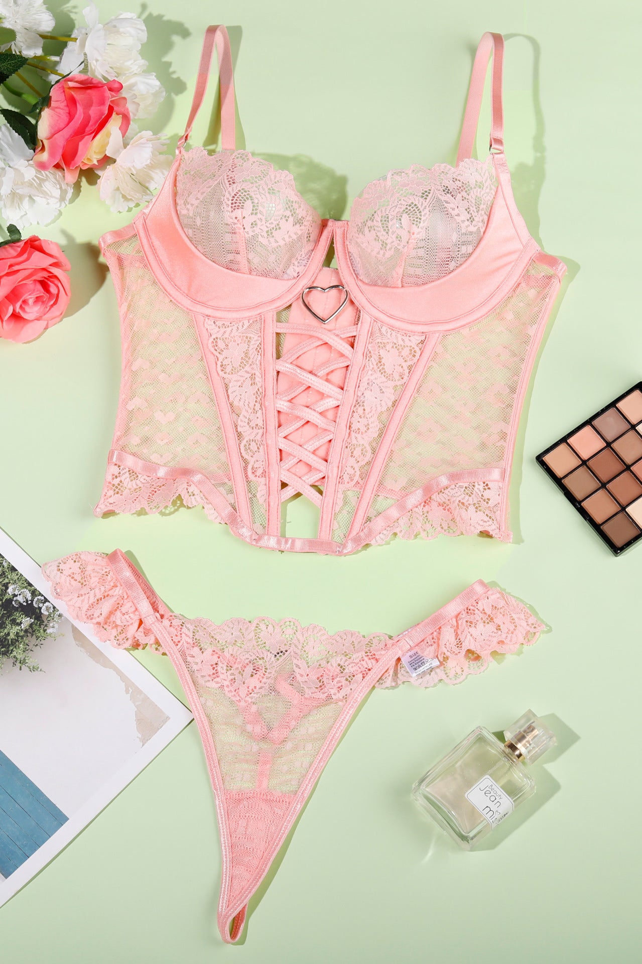 Pink lace lingerie set with matching thong, perfect for women’s fashion ملابس