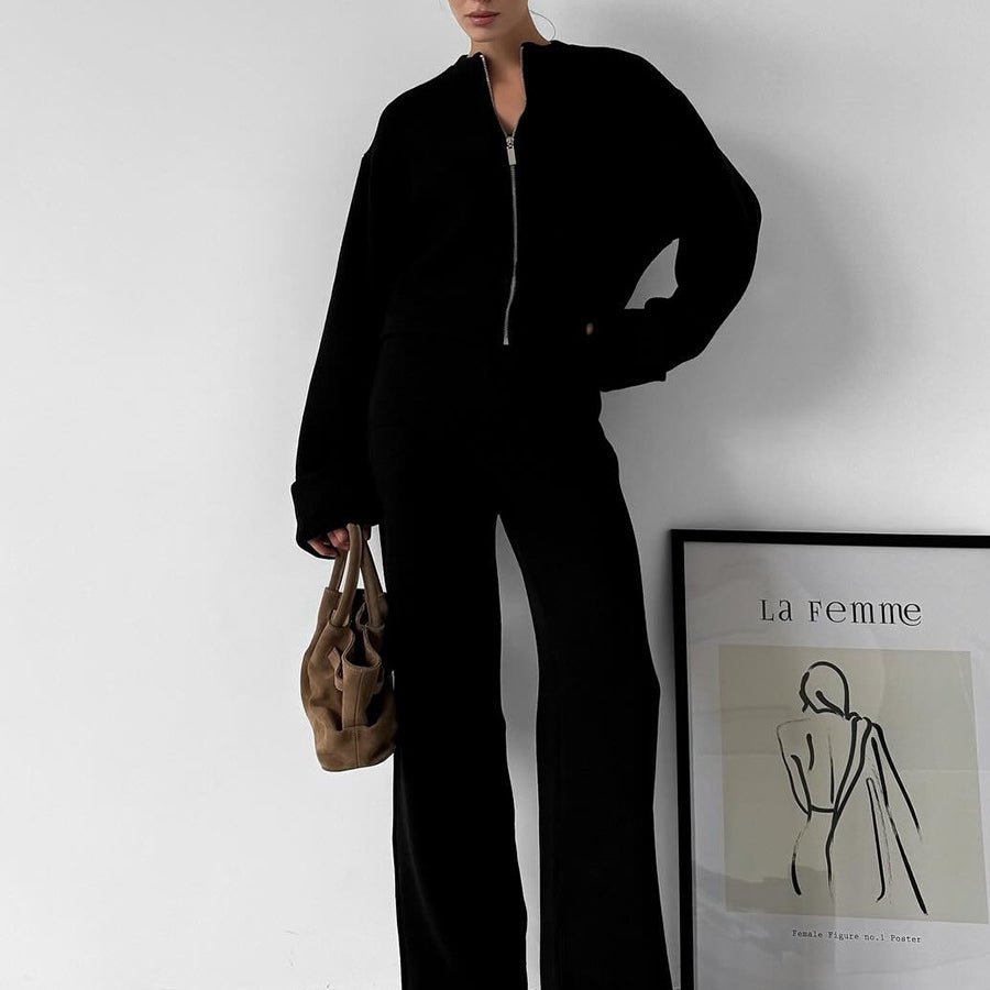 Black zip-up langry jumpsuit with wide-leg pants and pockets, enchanting fashion ملابس