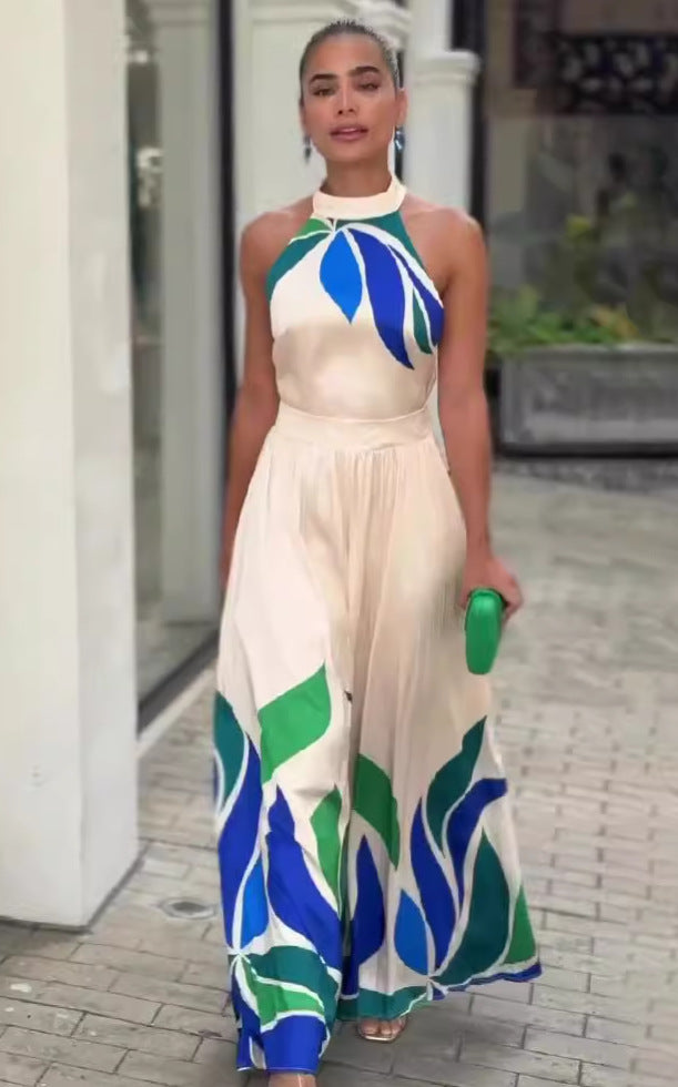Summer printed cream maxi dress with leaf patterns, halter neckline, and flowing skirt