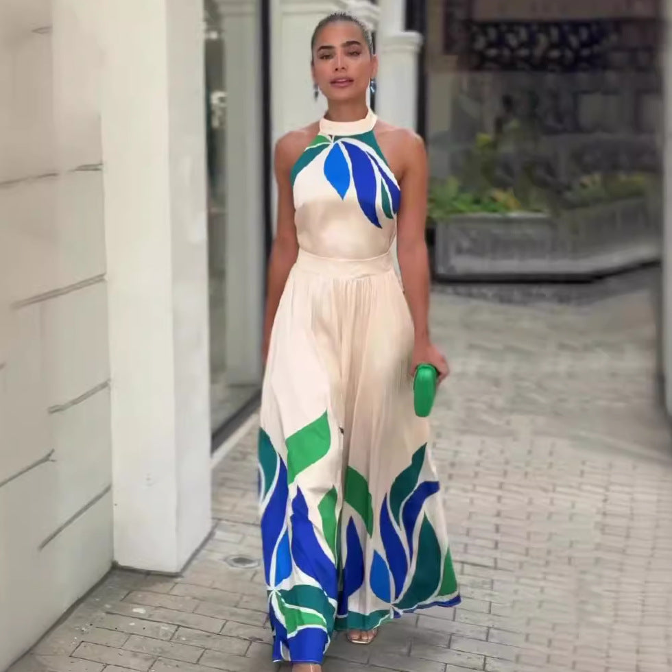 Summer printed cream maxi dress with leaf patterns, halter neckline, and flowing skirt