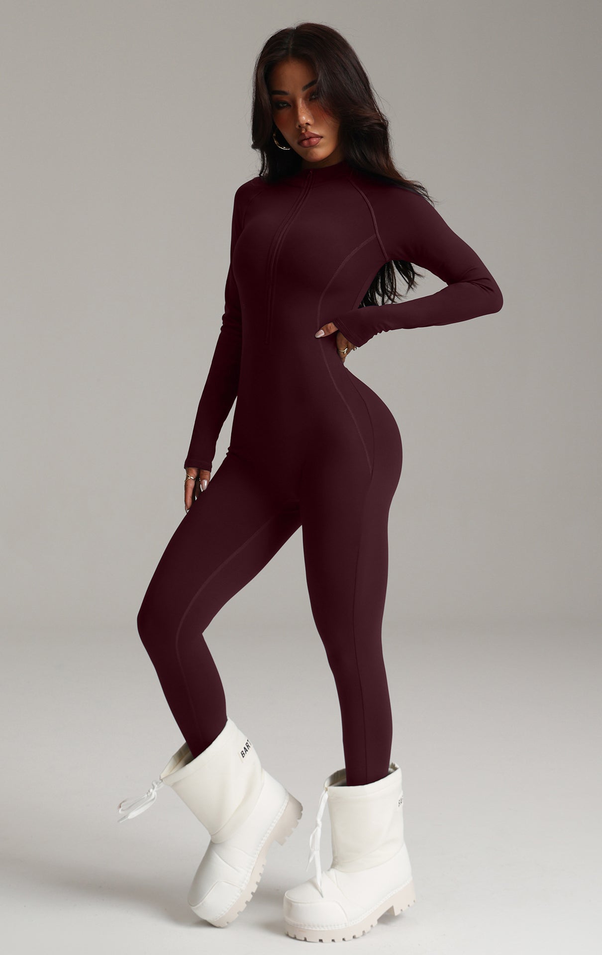 Burgundy stretchy langry fashion bodysuit with white chunky platform boots