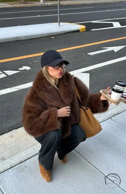Gorgeous faux fur Langry fashion jacket with oversized sleeves and black cap