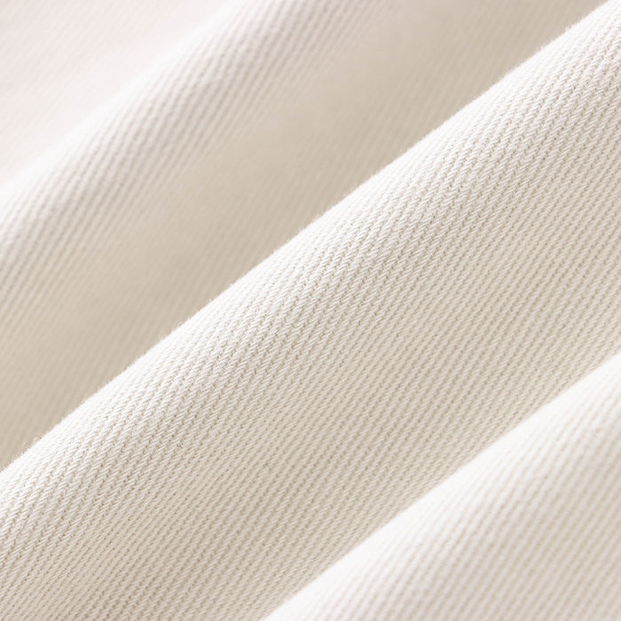 Diagonal folds of cream fabric with ribbed texture on Street Design Wide Leg Jeans, ملابس