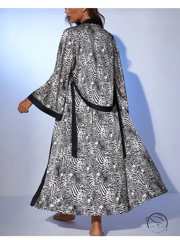 Loose long tie satin nightgown in black and white zebra print with high collar and slits