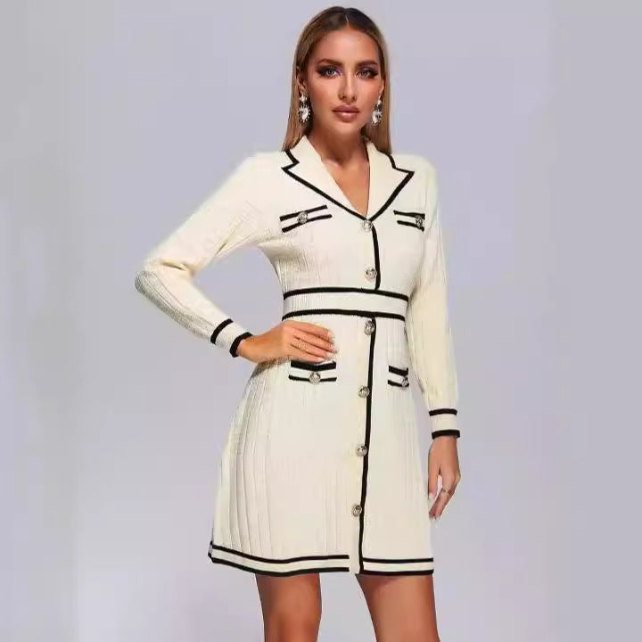 Cream-colored knitted classic dress with black trim, perfect for a timeless look