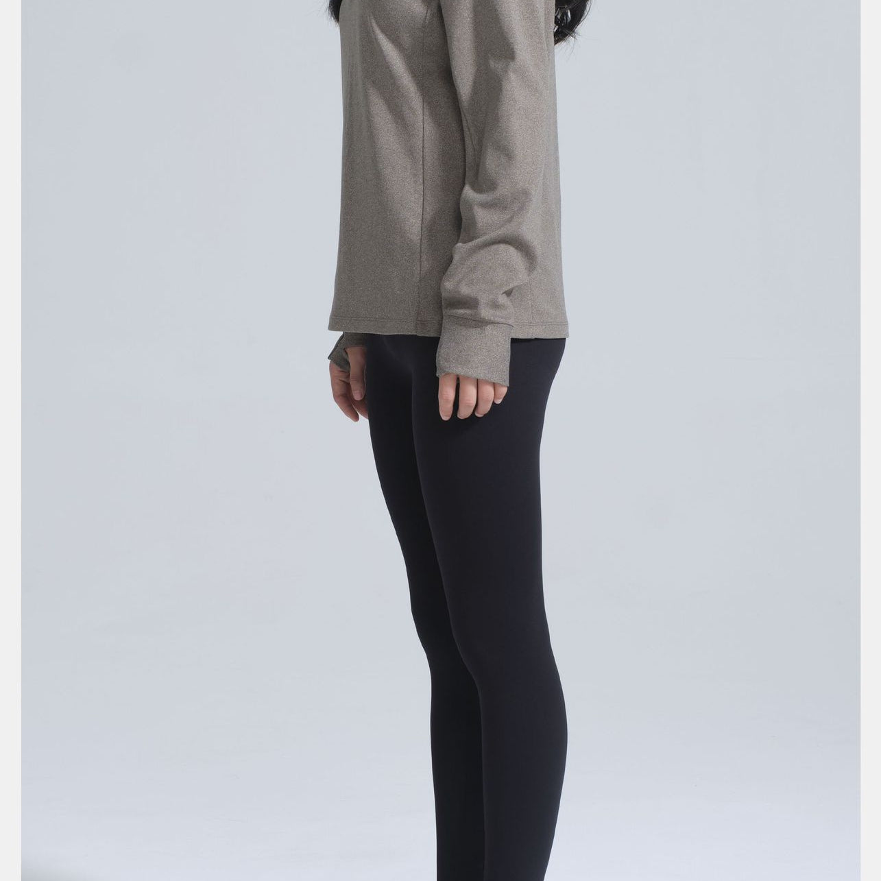 Winter Thermal Velvet Long Sleeved Yoga Jacket worn with black leggings and athletic shoes