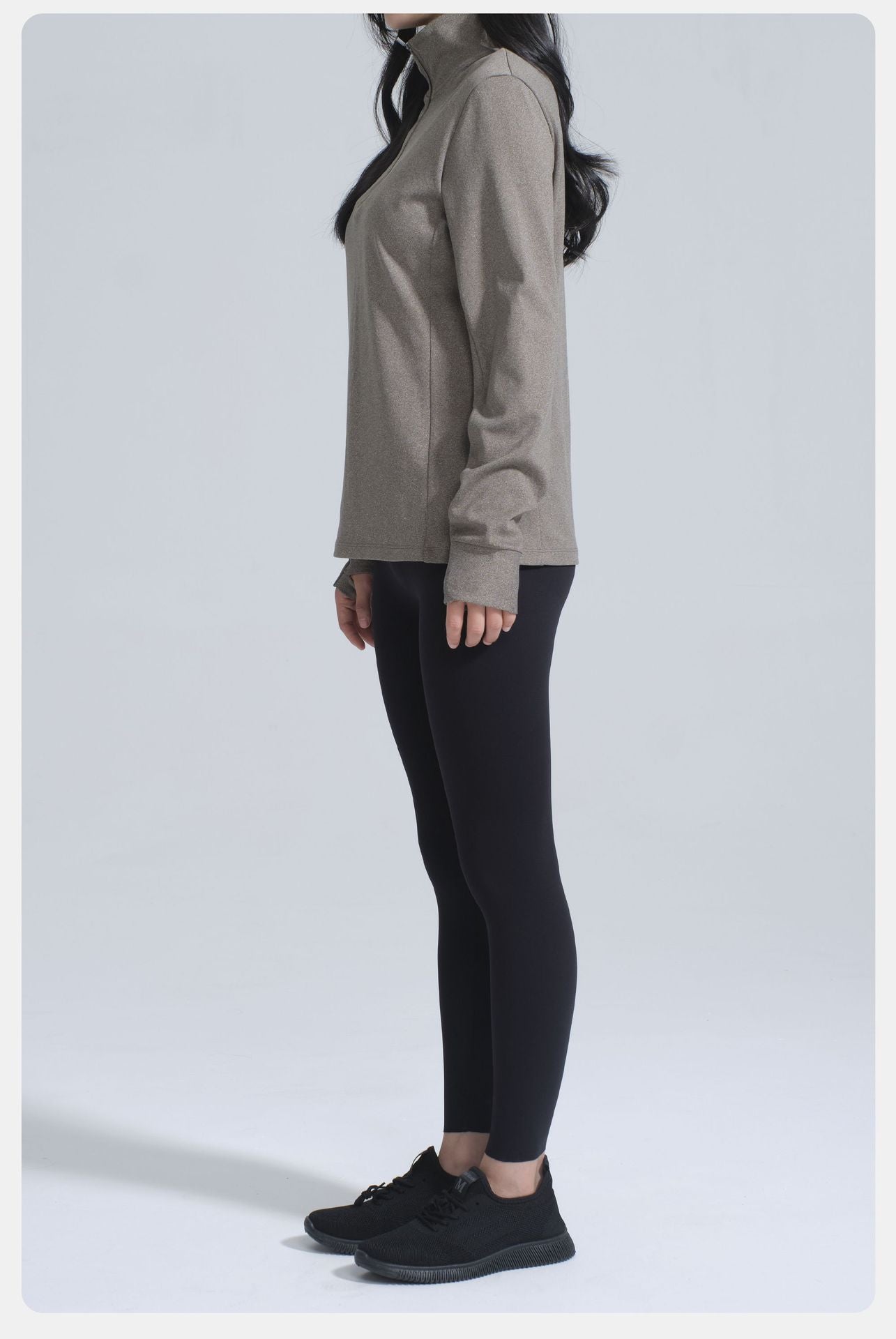 Winter Thermal Velvet Long Sleeved Yoga Jacket worn with black leggings and athletic shoes