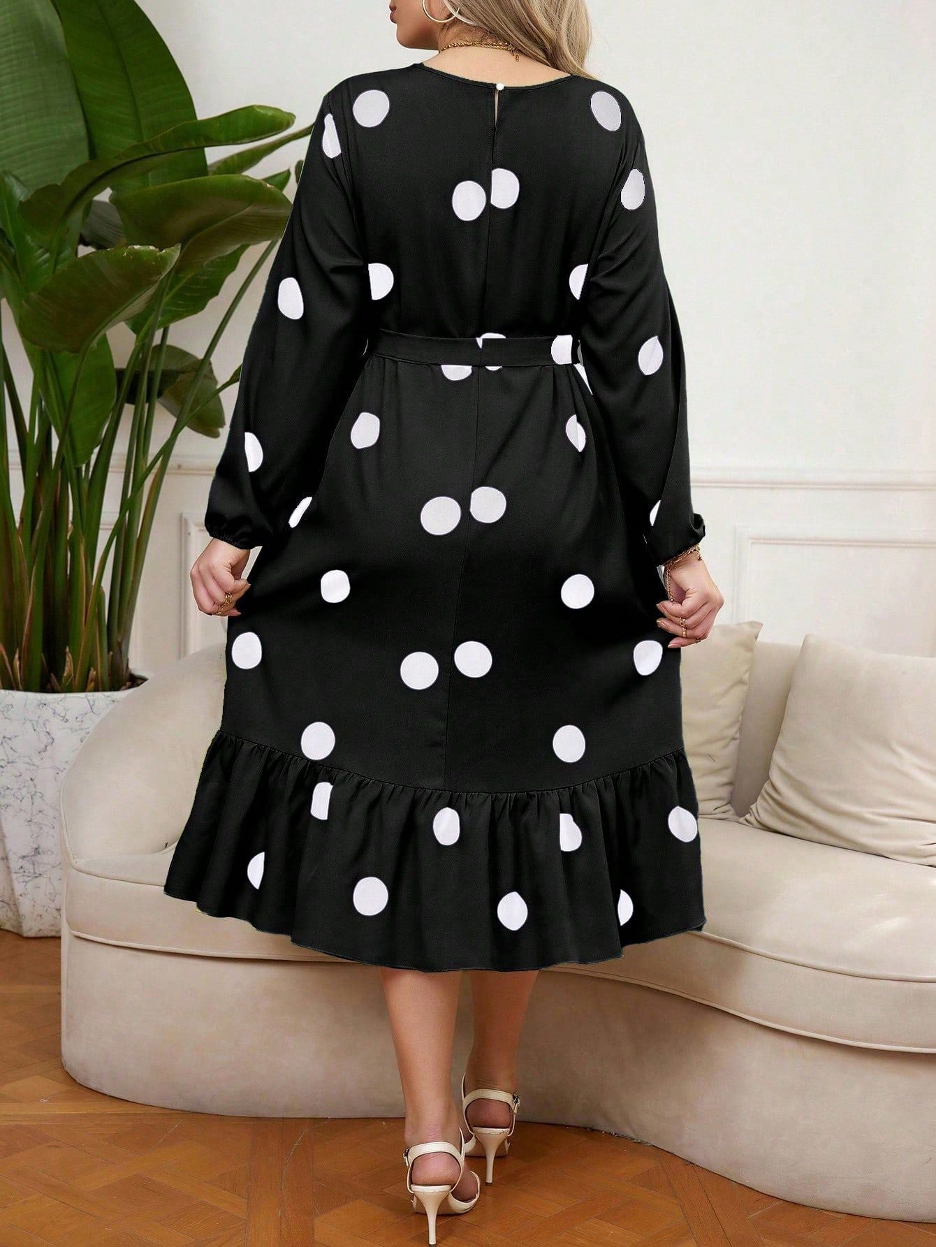 Black polka dot Lotus Leaf Dress with ruffled hem and long sleeves for elegant style