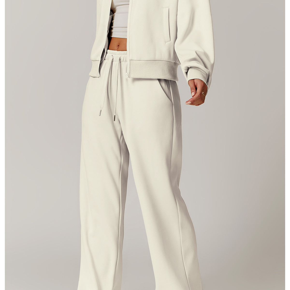 Woman in off-white lounge set wearing Outdoor Warm Sports Sweater Coat, perfect for langry fashion and ملابس