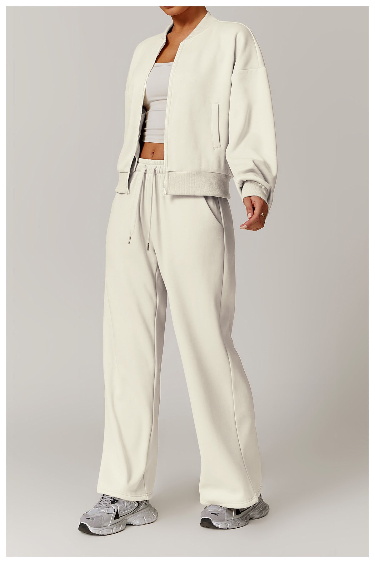 Woman in off-white lounge set wearing Outdoor Warm Sports Sweater Coat, perfect for langry fashion and ملابس
