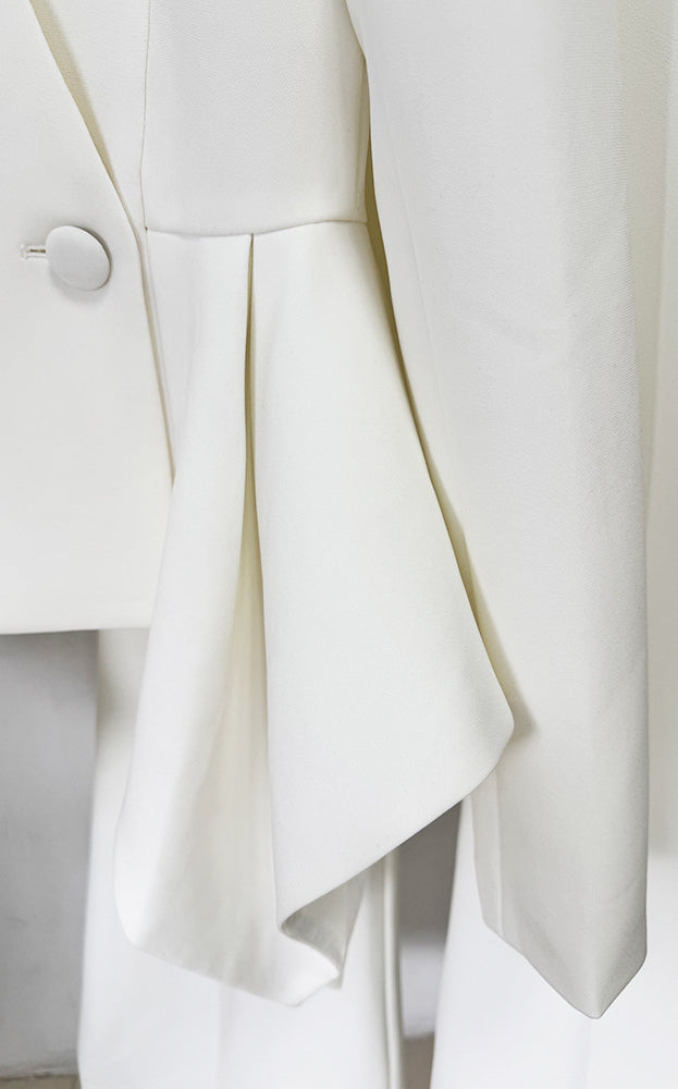 White asymmetrical pleated Langry fashion skirt with silver buttons