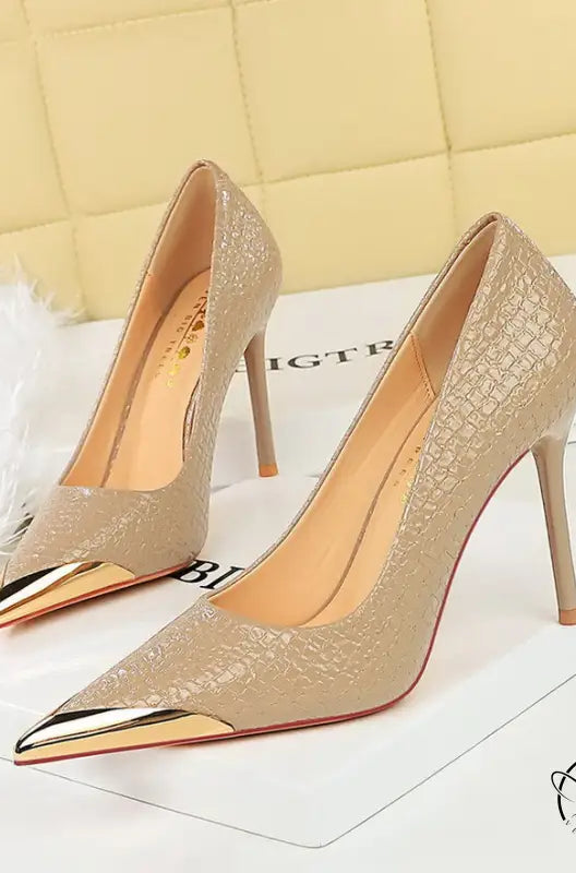 Elegant beige stiletto heels with gold toe caps in langry fashion