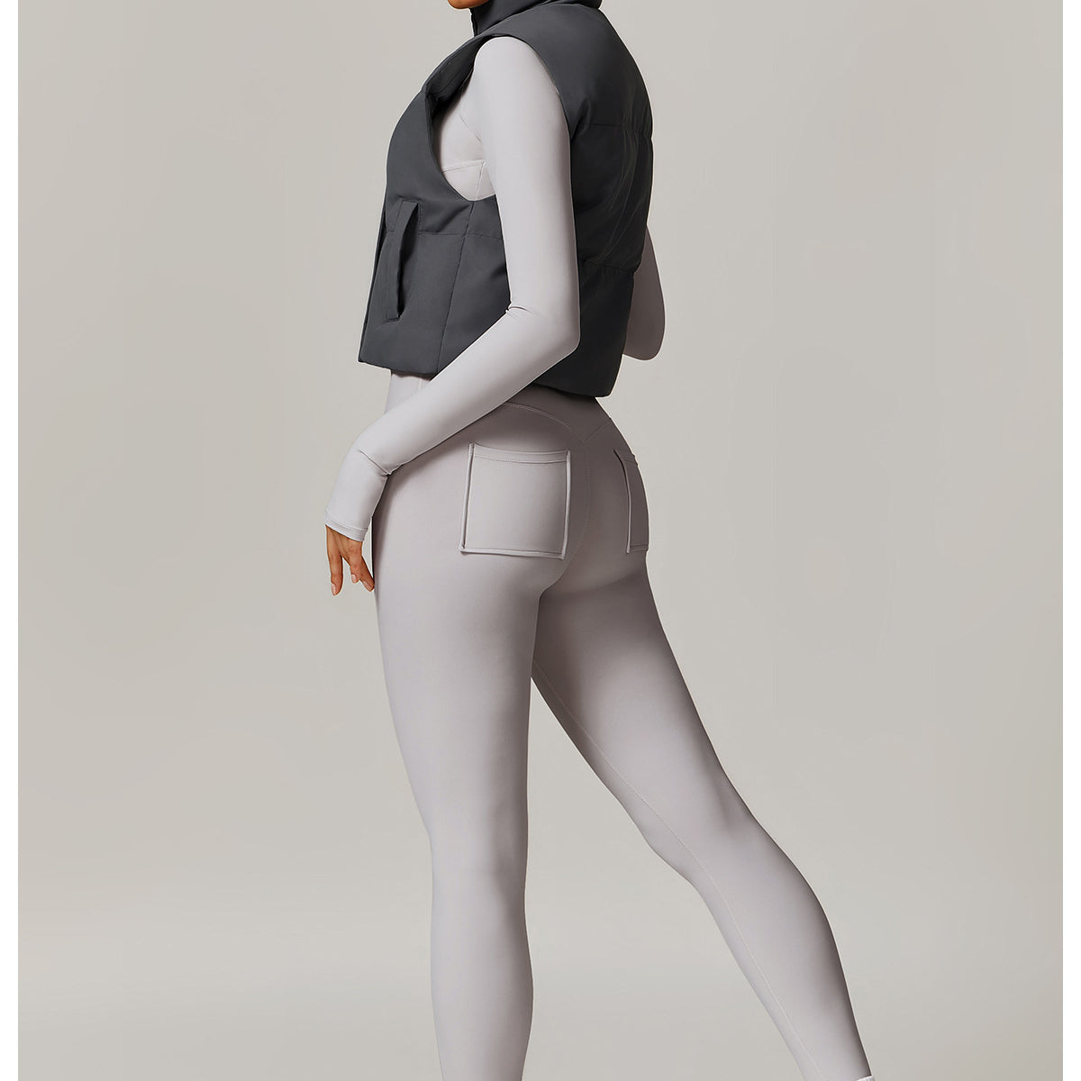 Woman’s athletic outfit featuring a stylish Winter Fashionable Warm Vest Coat for langry fashion and ملابس