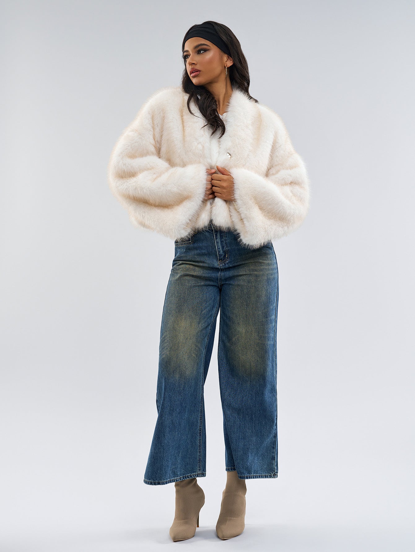Woman in a white fuzzy coat with wide-leg jeans and tan boots showcasing Fur Short Coat fashion