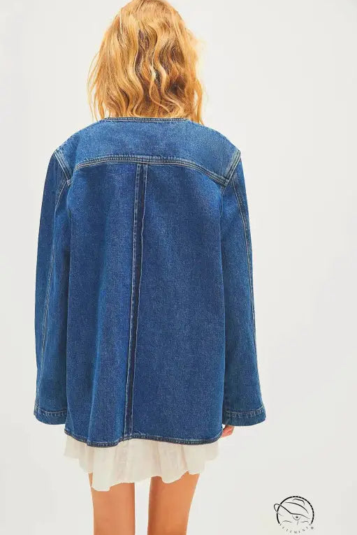 Woman in casual fashionable cowboy coat over ruffled dress