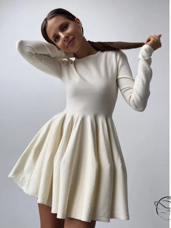 Beautiful woolen knitted cream-colored fit-and-flare dress