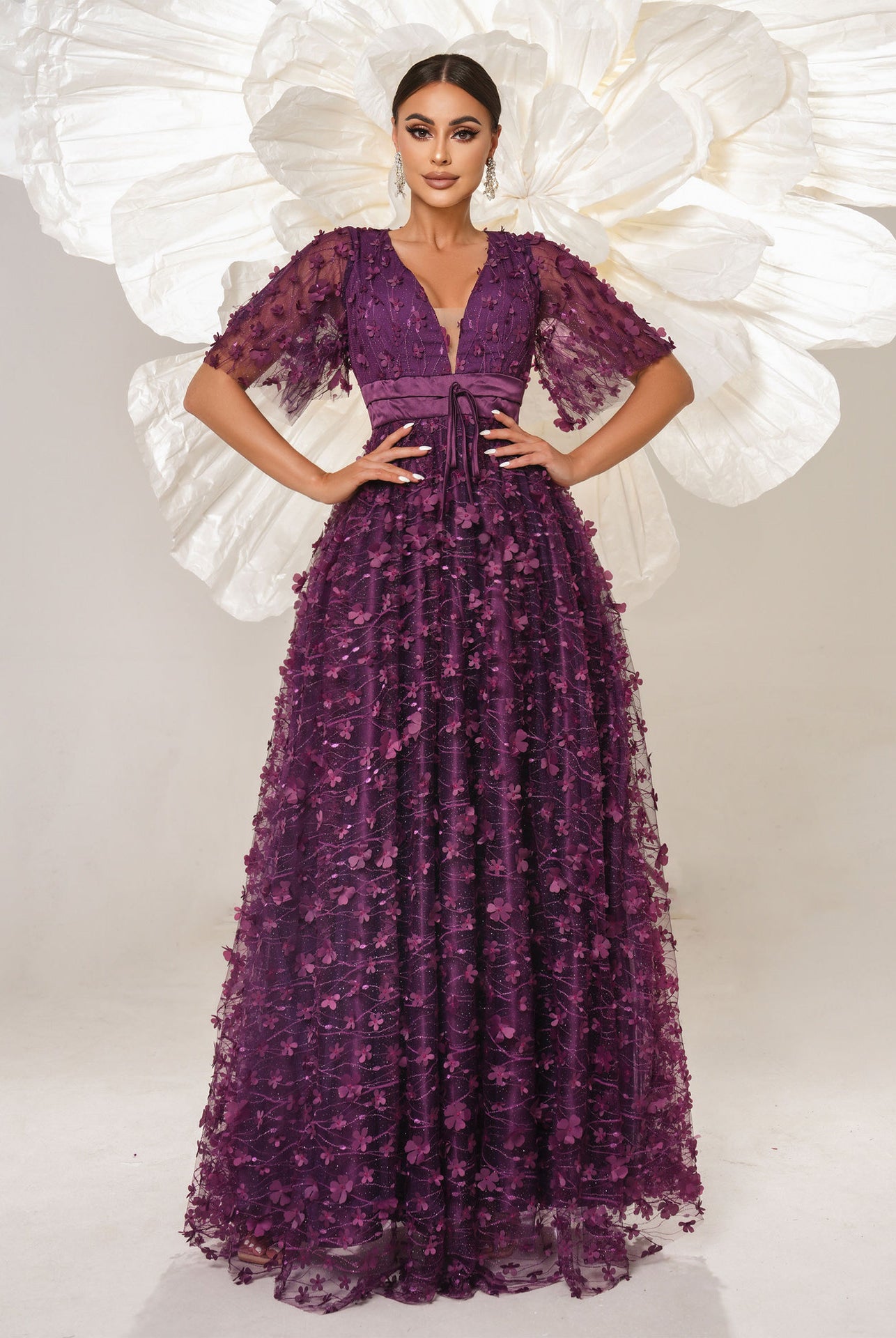 Elegant purple floral gown showcasing high-end fashion for bridesmaids and evening events
