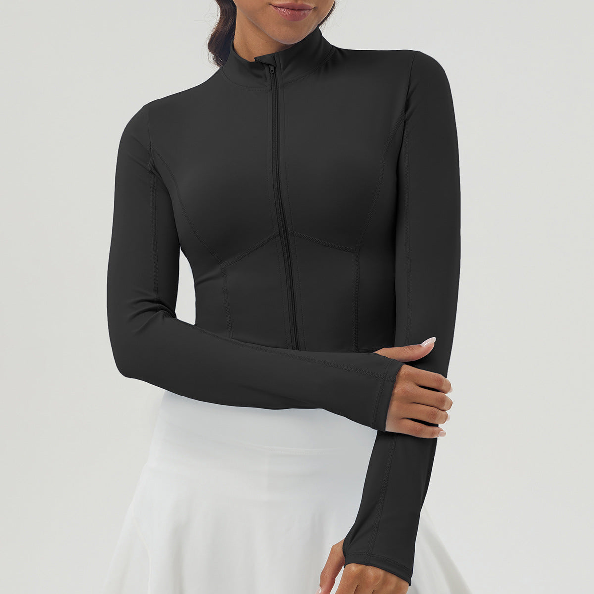 Black long sleeve athletic top with mock neck and full-zip for outdoor sports fashion