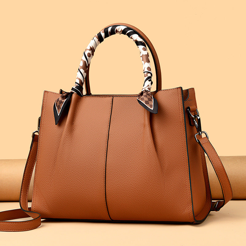 Elegant Langry genuine leather tote bag with leopard print handle and black accents in fashion style