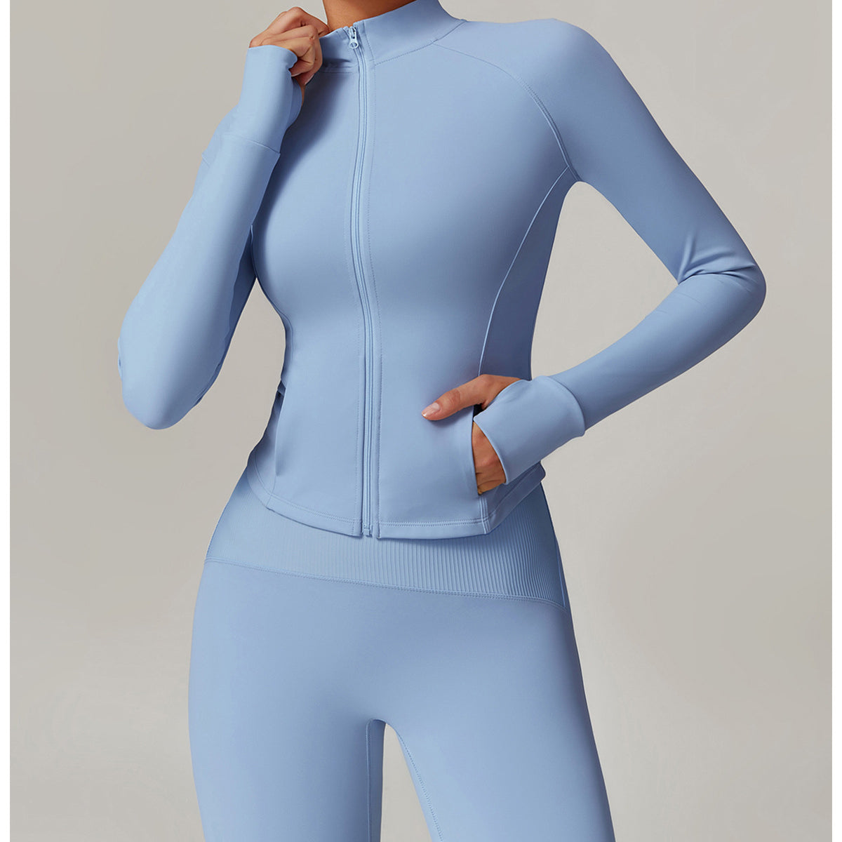 Light blue langry fitted workout set featuring a zip-front jacket and matching leggings