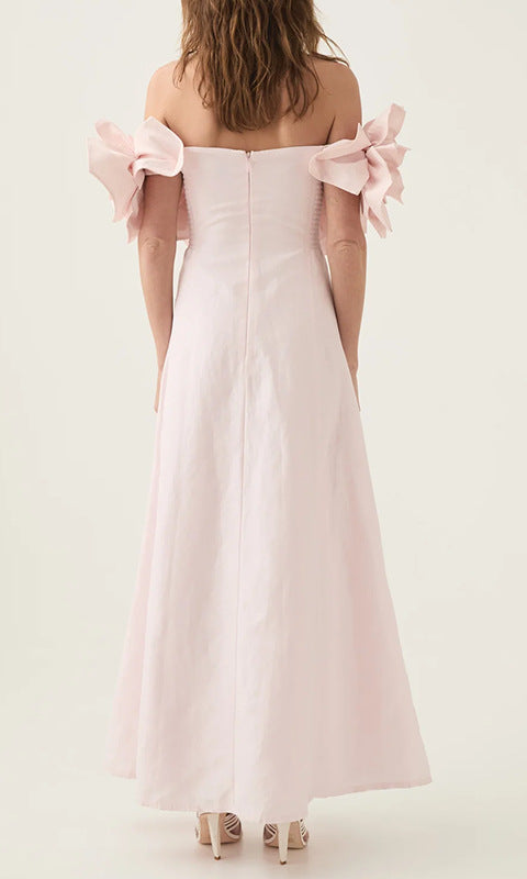 Off-the-shoulder pink maxi dress with floral accents, ideal for elegant fashion occasions