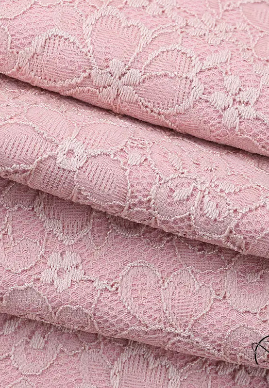 Elegant dusty rose lace jumpsuit with floral pattern and delicate texture in langry fashion