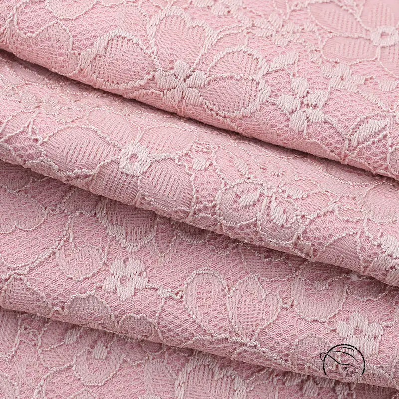 Elegant dusty rose lace jumpsuit with floral pattern and delicate texture in langry fashion