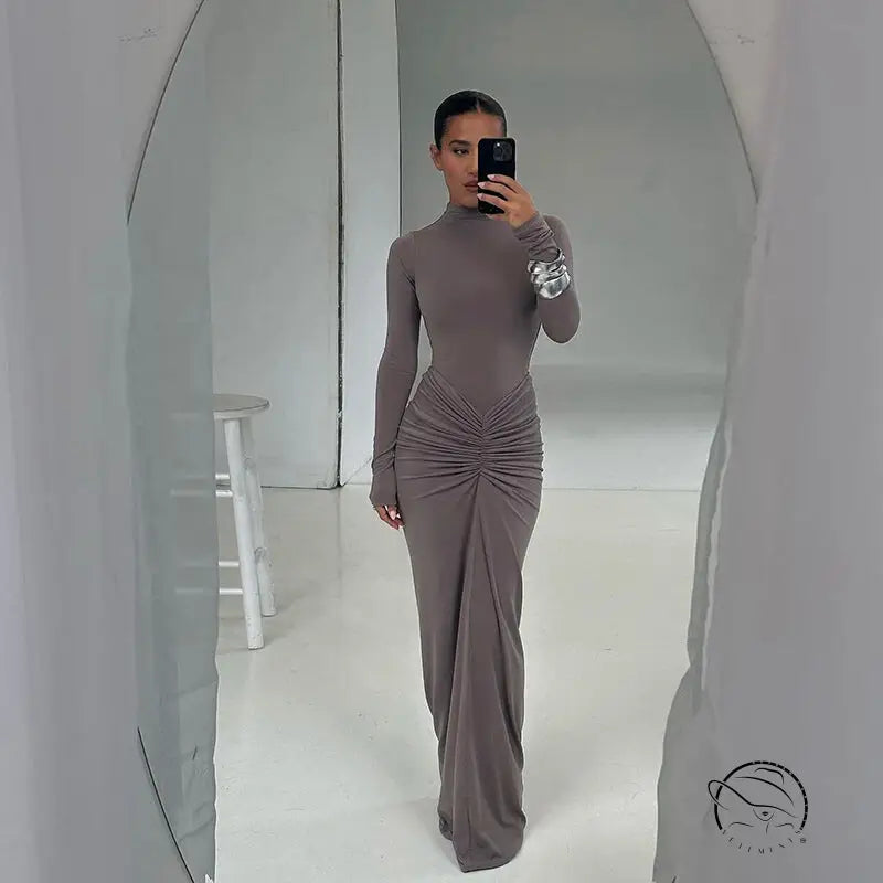 Taupe long-sleeved maxi dress with elegant slimming waist design
