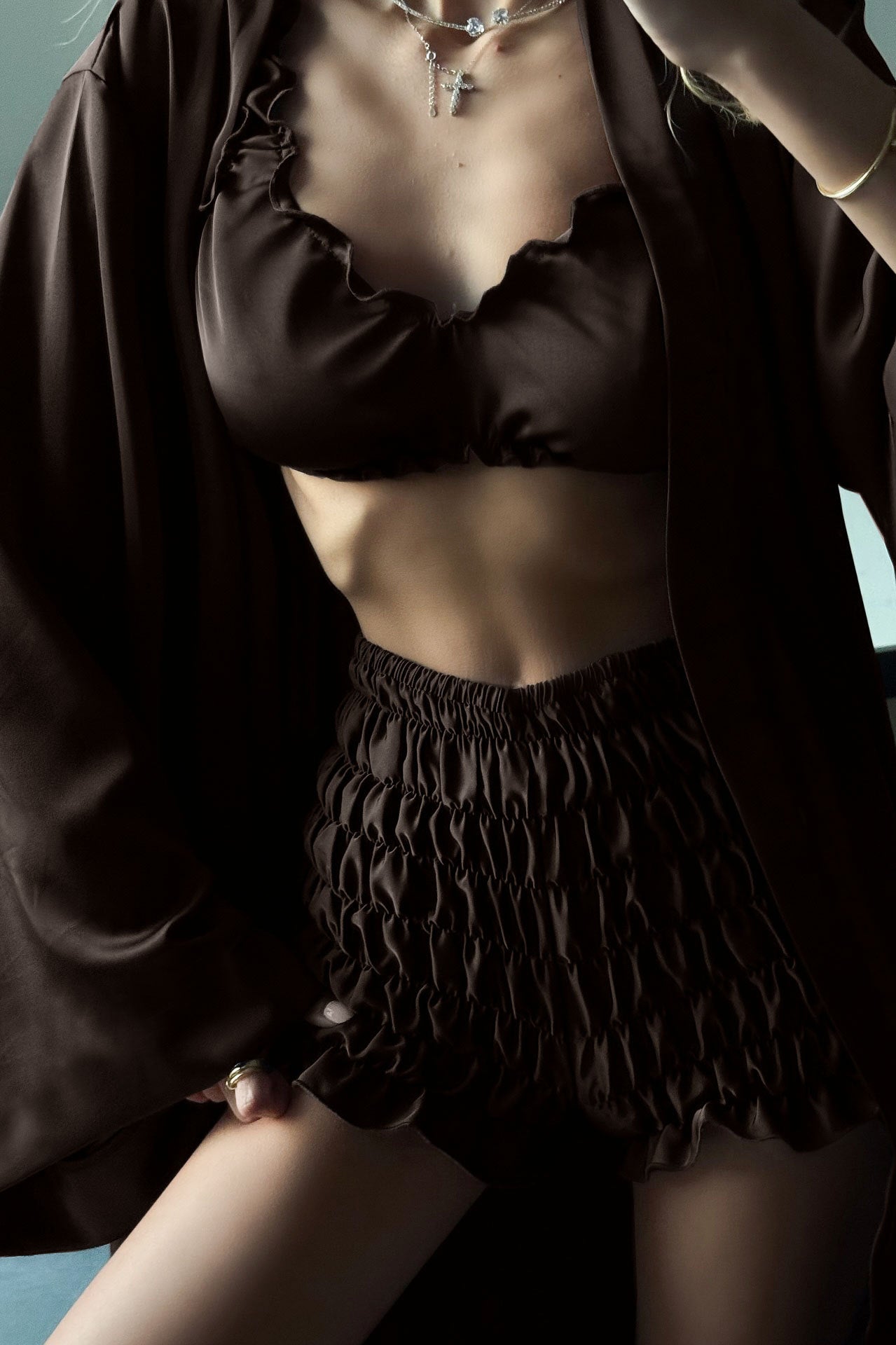 Pleated satin black scalloped edge shorts with ruffle details