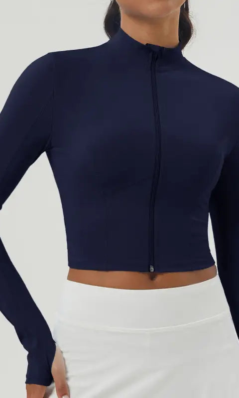 Women’s navy blue long sleeve sports jacket with mock neck and zipper
