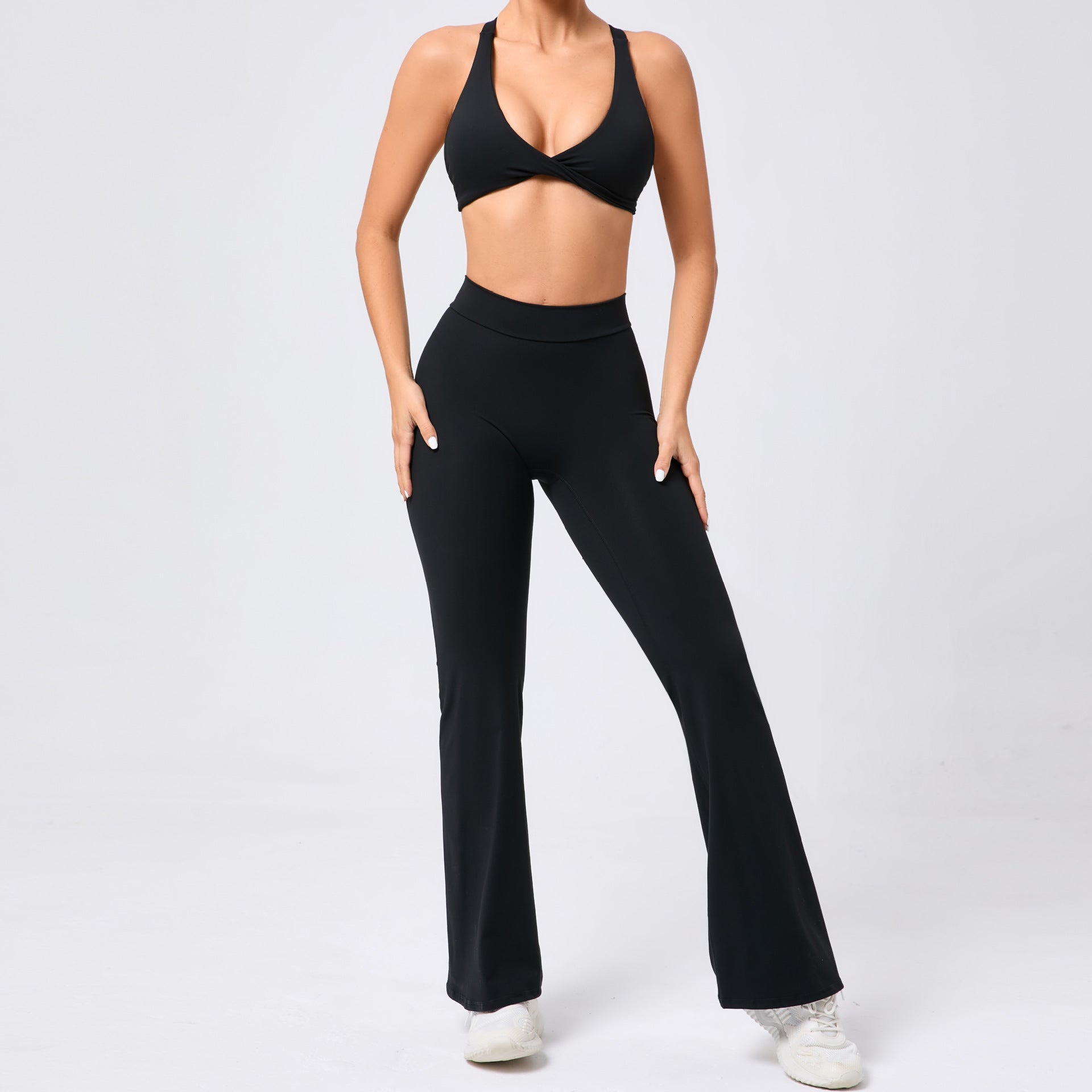Black tight brushed yoga pants with peach hip raise set and white sneakers