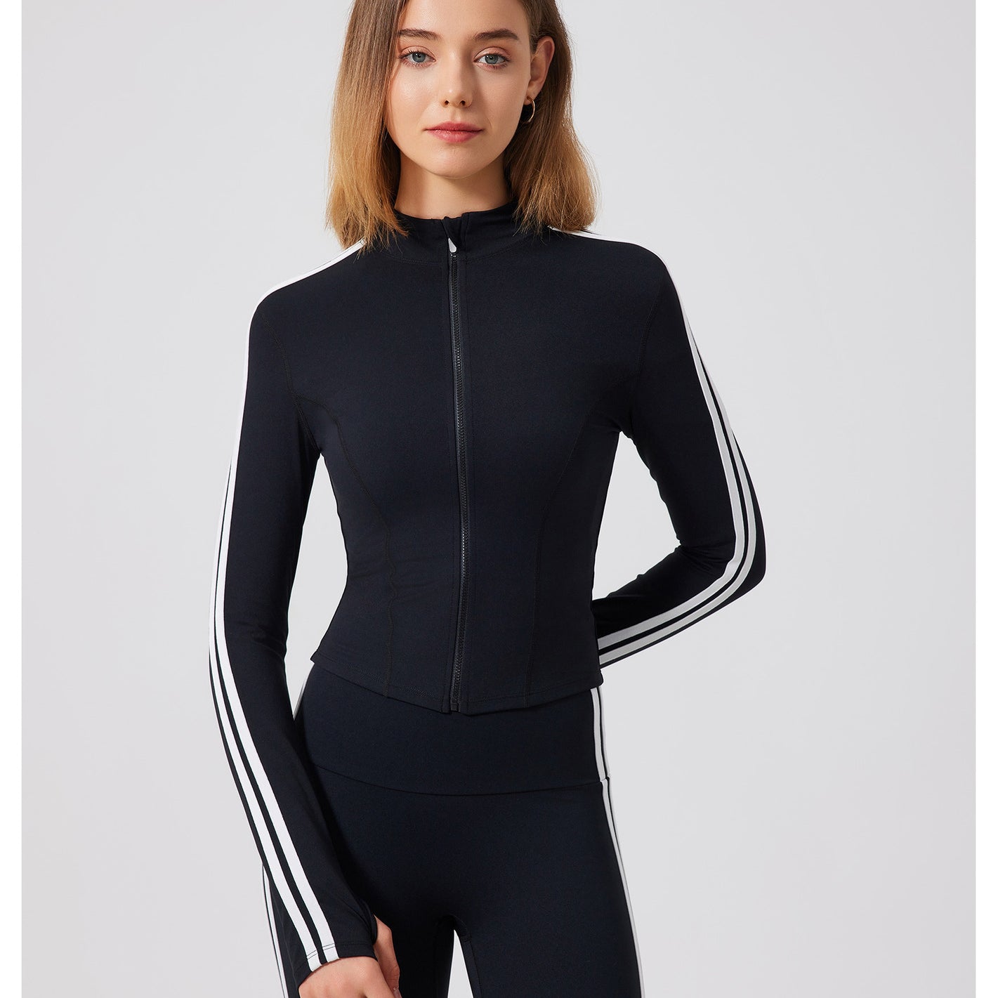 Black adidas tracksuit with white stripes and zipper for running skin friendly fitness