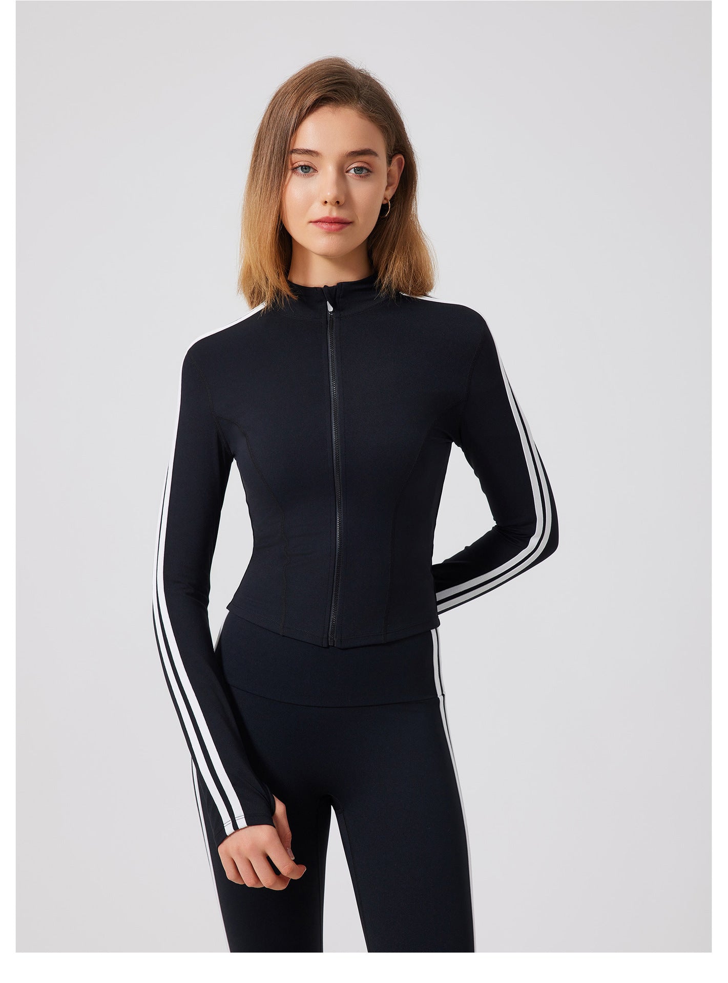 Black adidas tracksuit with white stripes and zipper for running skin friendly fitness