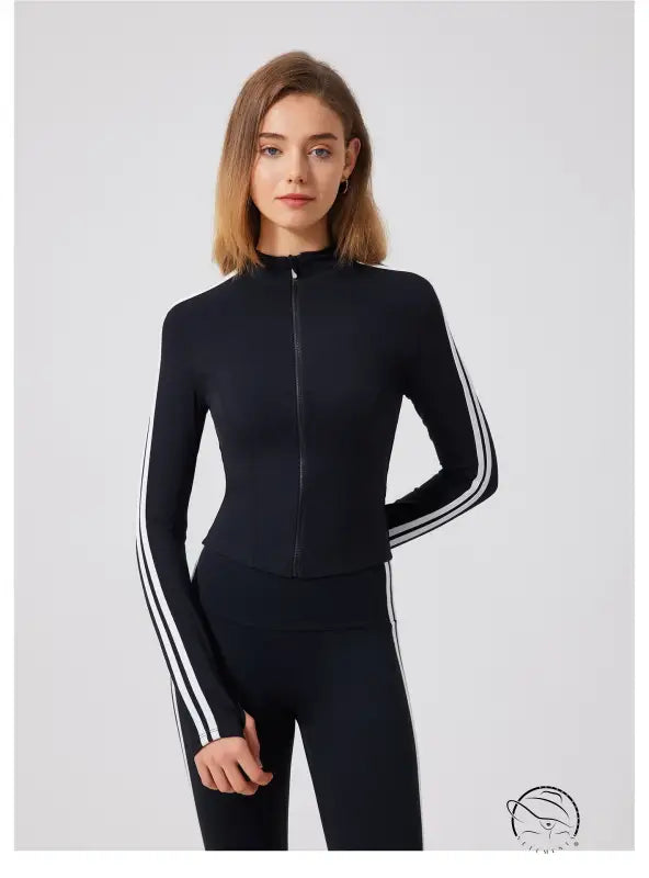 Black adidas tracksuit with white stripes and zipper, running skin friendly fitness top