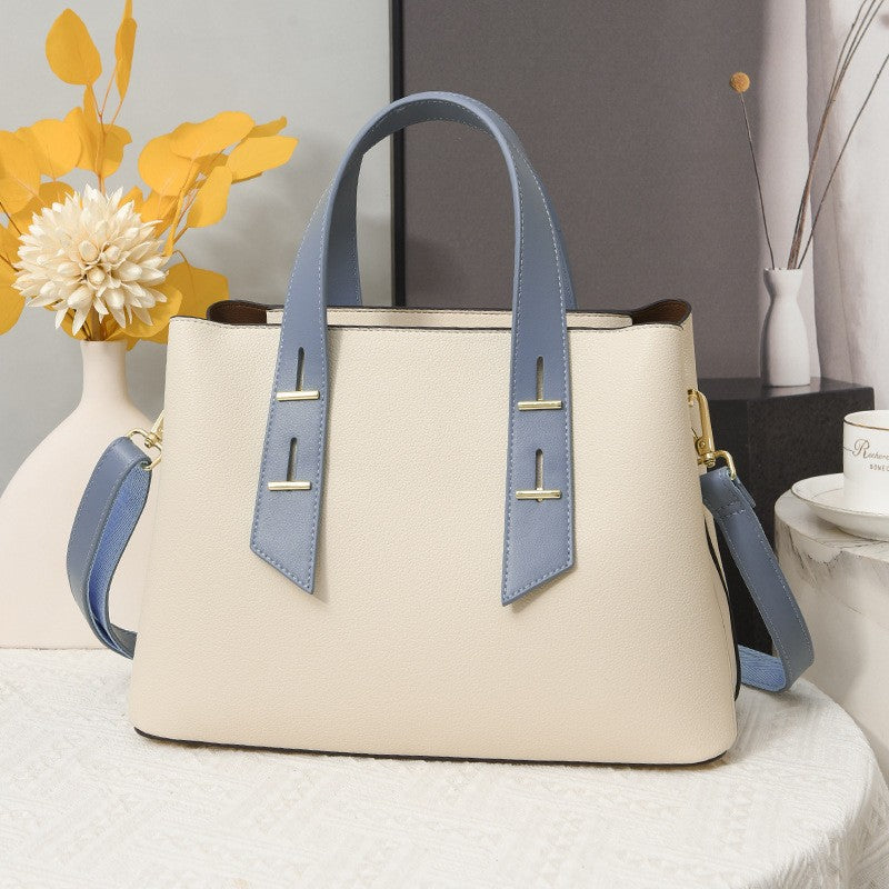 Langry fashion cream and blue leather tote bag with gold hardware
