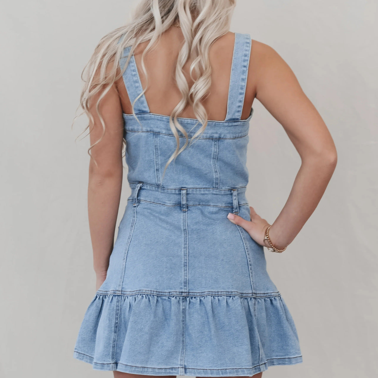 Light wash denim mini dress with tiered ruffle hem from Office Suspenders Denim collection
