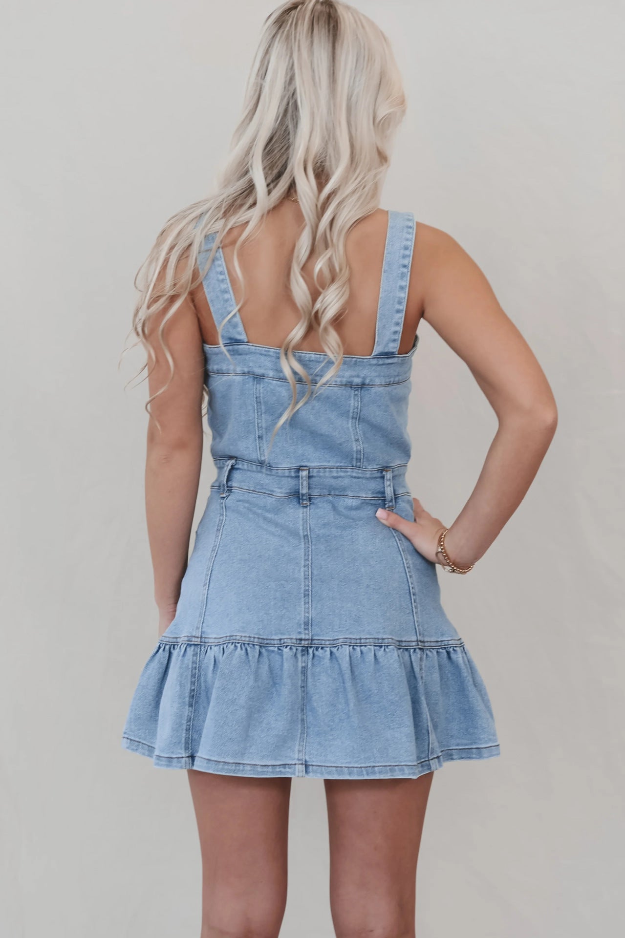 Light wash denim mini dress with tiered ruffle hem from Office Suspenders Denim collection