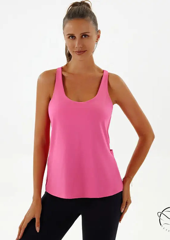 Woman in pink yoga breathable top and black leggings