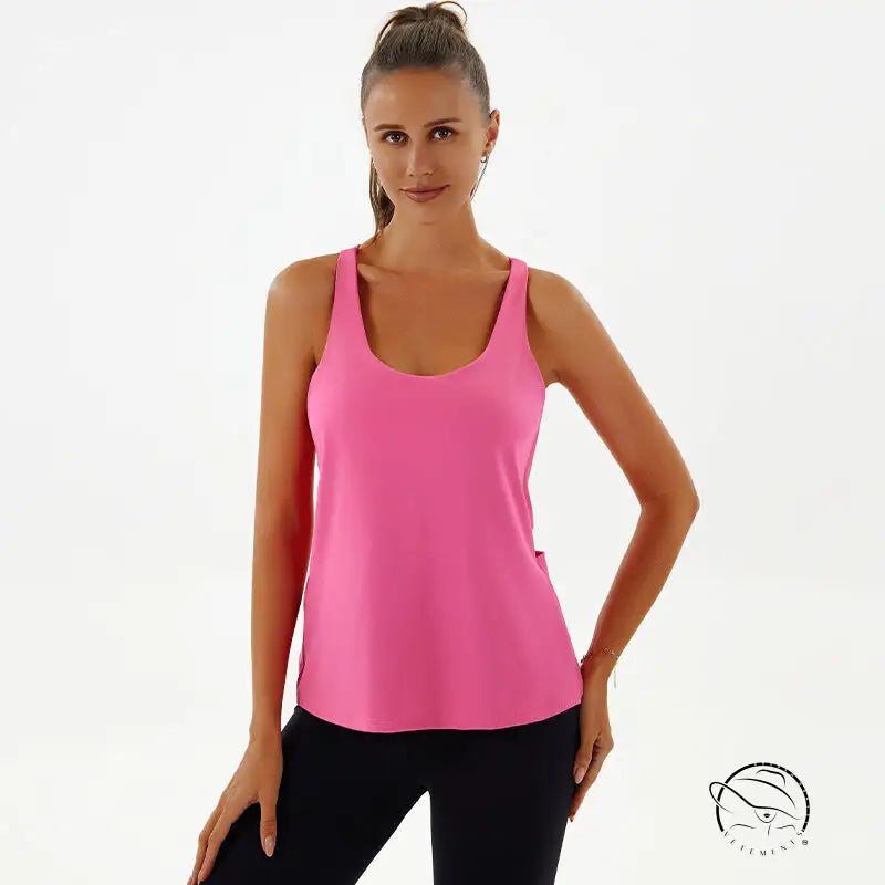 Woman in pink yoga breathable top and black leggings