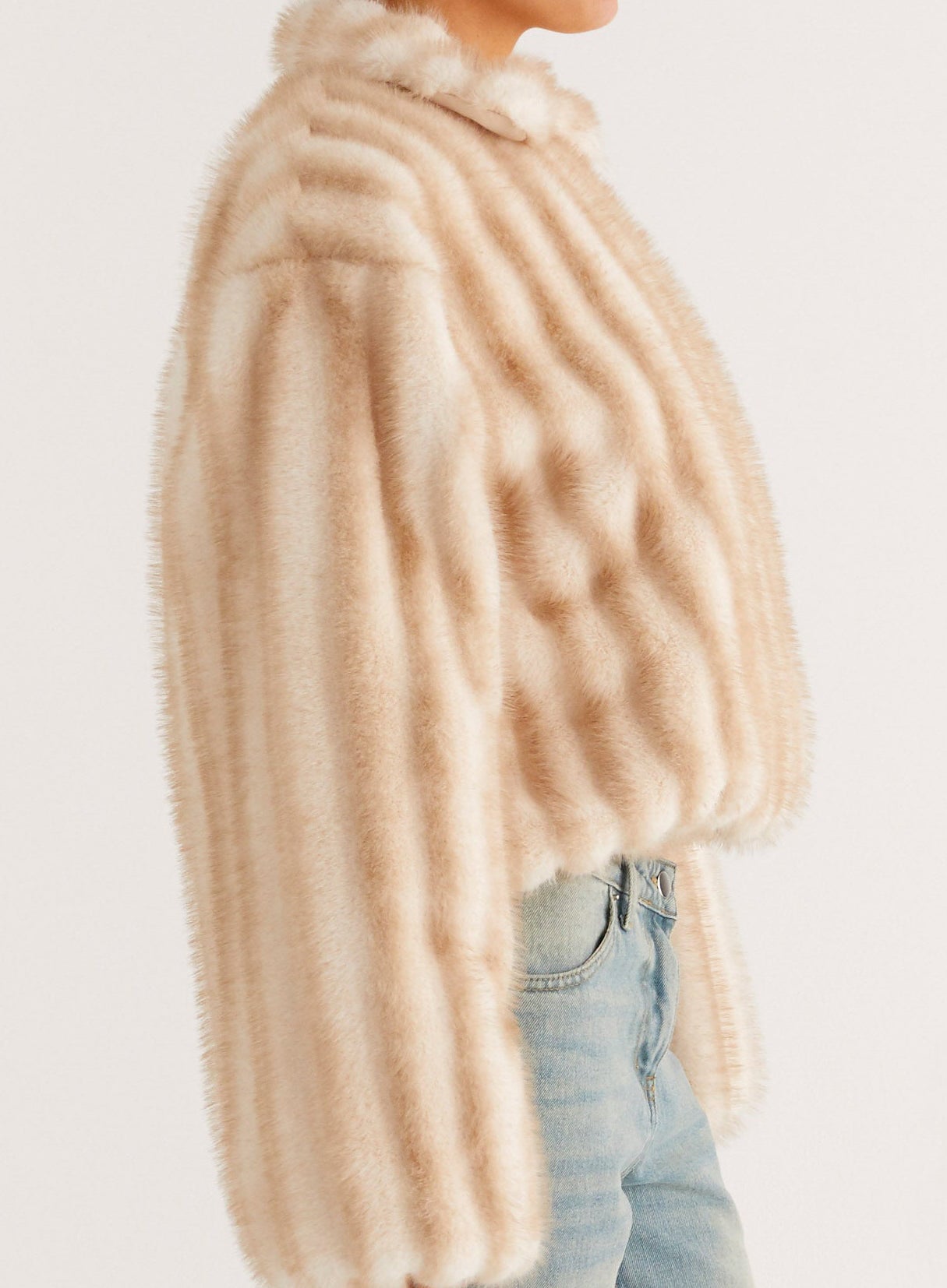 Cream faux fur oversized coat with ribbed texture and high collar