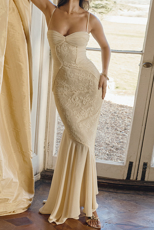 Lace-covered cream cami dress displayed elegantly for fashion-forward women