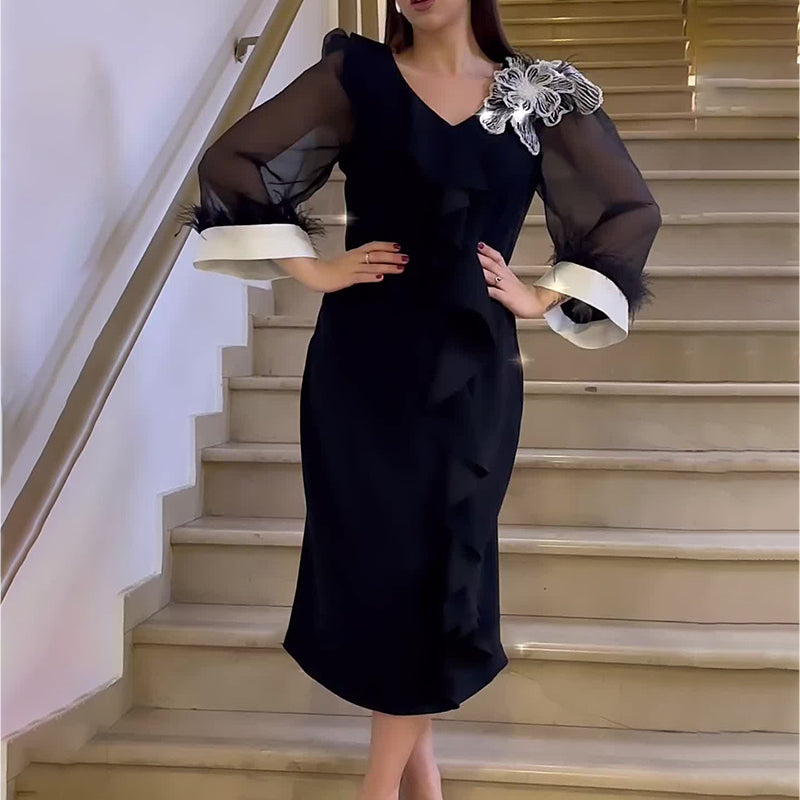 Elegant black long sleeve dress with sheer sleeves featured in Autumn V neck collection