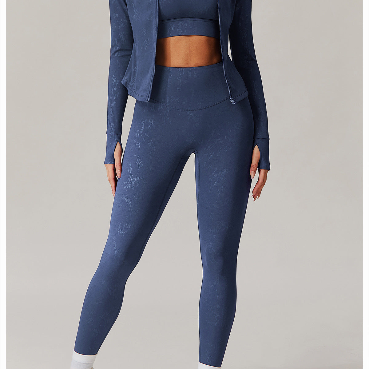 Navy blue women’s athletic set with textured patterns, thumbholes, ideal for langry fashion and ملابس